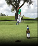 A person standing on a golf course

Description automatically generated